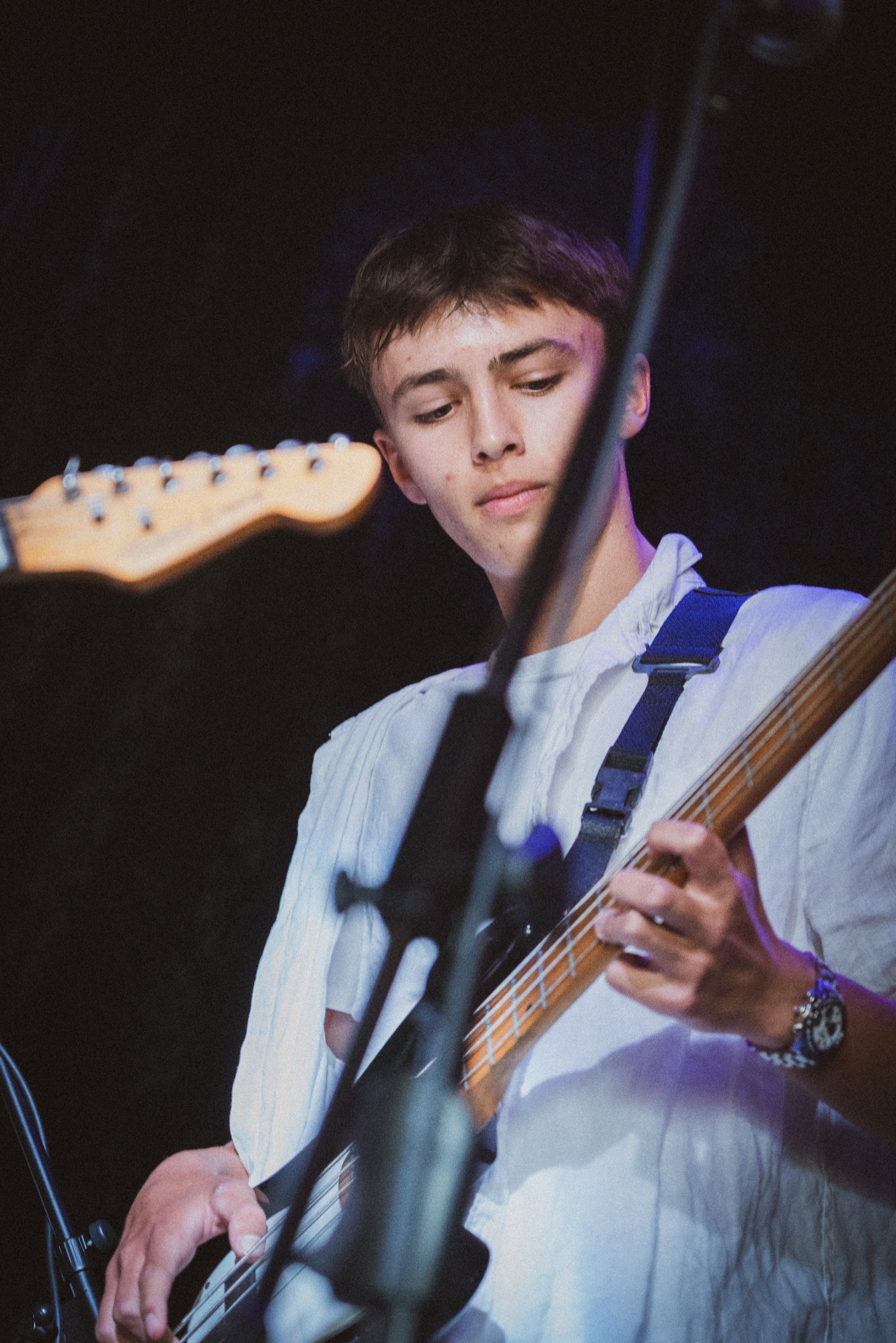 Young bassist performing live