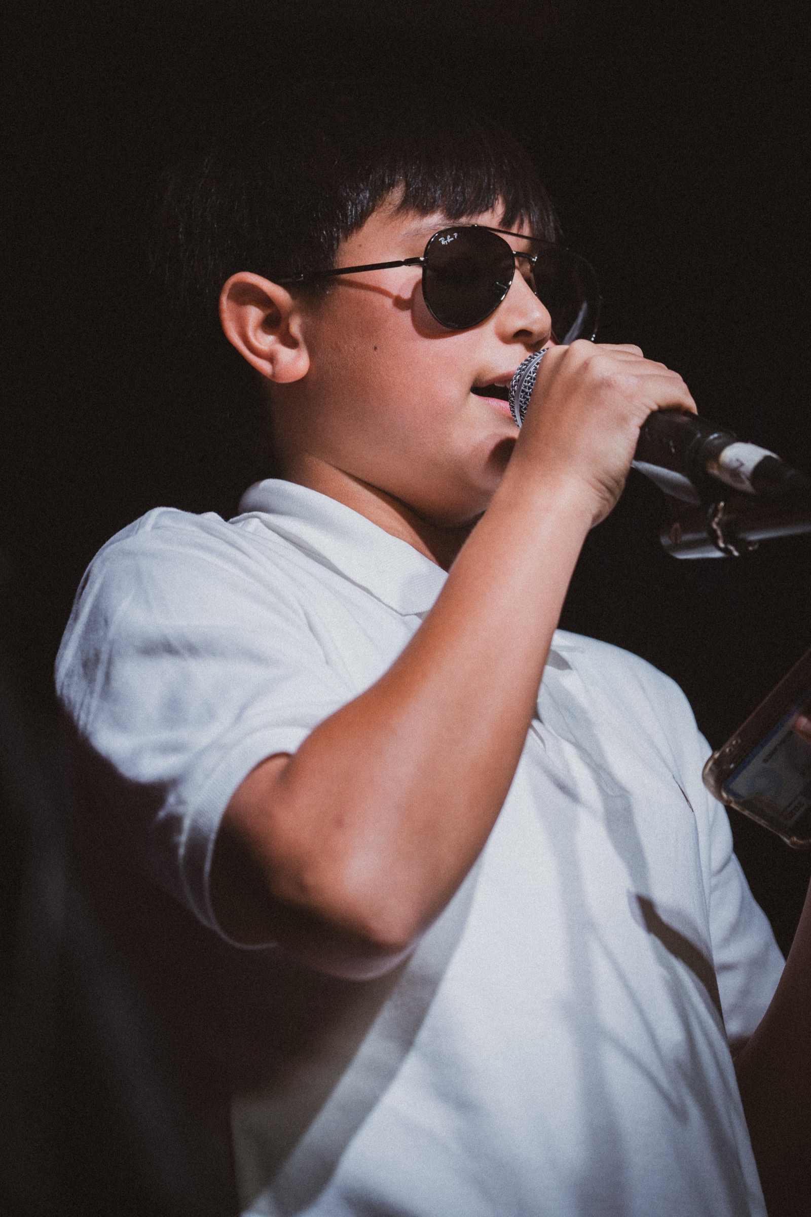 Vocalist singing with sunglasses