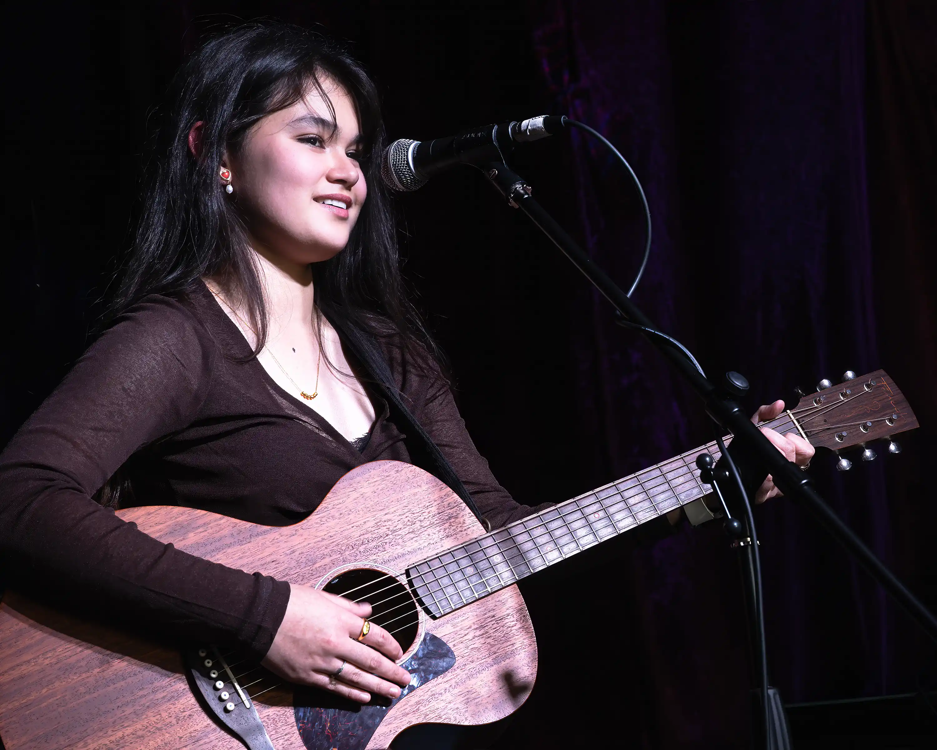 Female guitarist with acoustic guitar